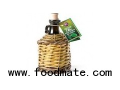Extra virgin olive oil D.O.P. in bottle covered with straw