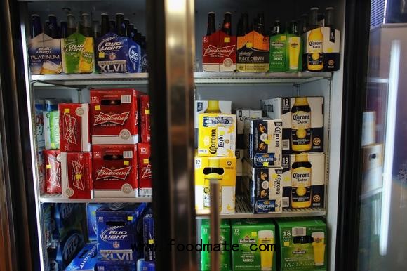 A cooler holds Anheuser-Busch's Budweiser and Grupo Modelo's Corona Light beers 